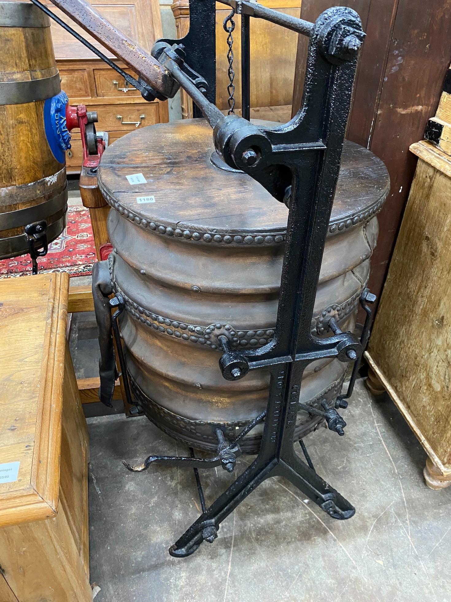 An 19th century cast iron oak and leather blacksmiths bellows by Linley and Son, Sheffield height 136cm.